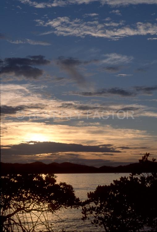 (Multiple values);sun;papua new guinea;water;sillouettes;colorful;reflections;volcano